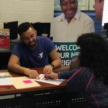 Y staff providing immigration application assistance